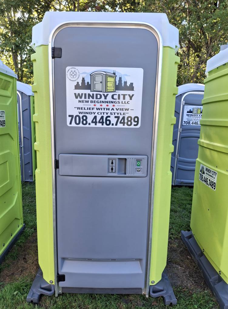 Front of a Windy City New Beginnings portable restroom with branded decal