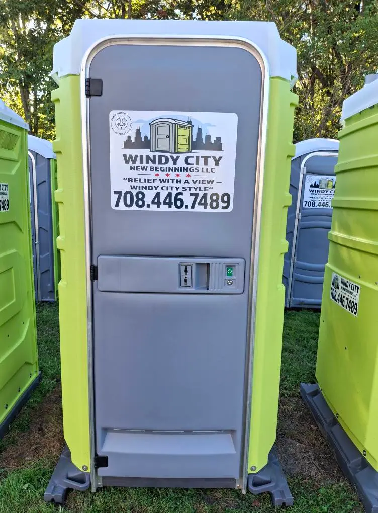 Front of a Windy City New Beginnings portable restroom with branded decal