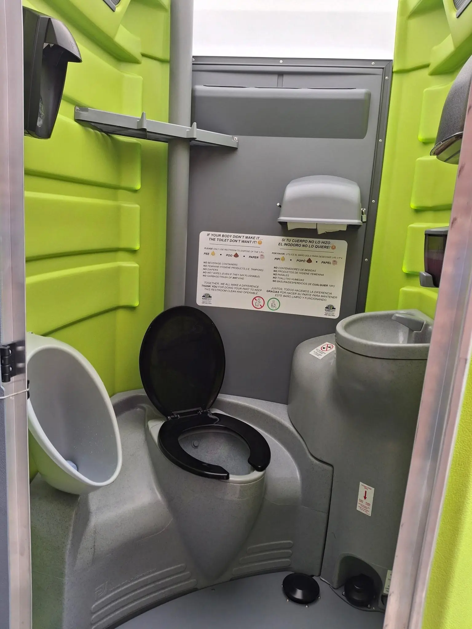 Interior of a Windy City Deluxe PLUS unit with sink and urinal